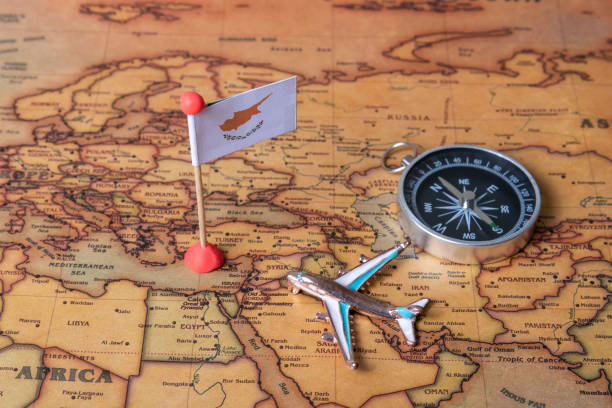istock Cyprus flag, compass and plane on the world map. 1289021247