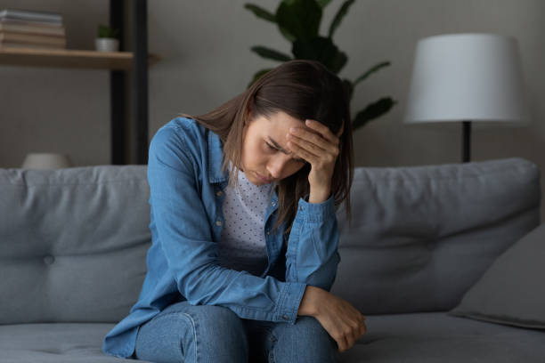 istock Unhappy young woman missing alone at home 1289021380