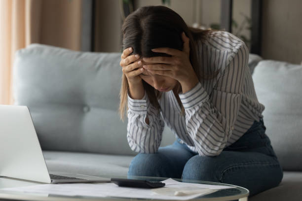 istock Unhappy woman pay bills distressed by financial problems 1289021390