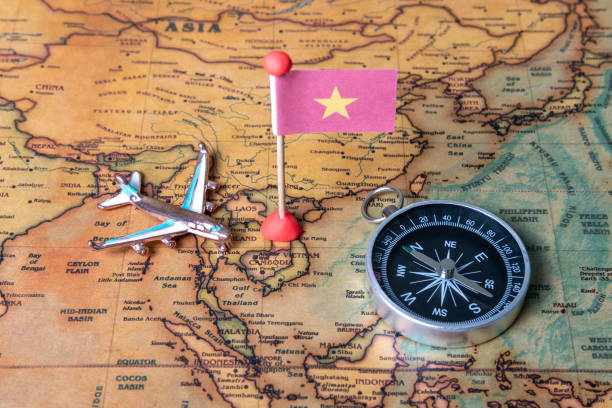 istock Vietnam flag, compass and airplane on the world map. 1289021613
