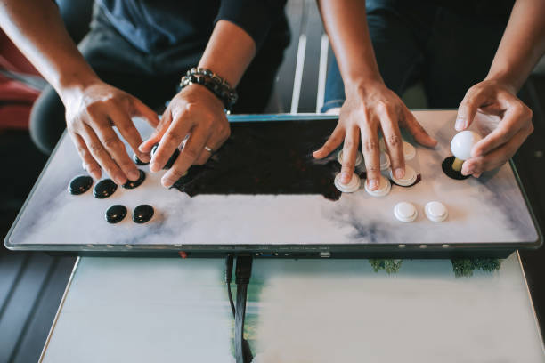 istock Two asian chinese male having fun and playing video game at villa 1289022314