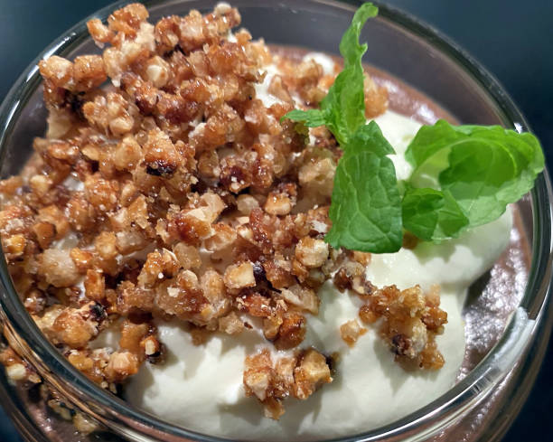 Home made chocolate mousse with crumb and mint leaf