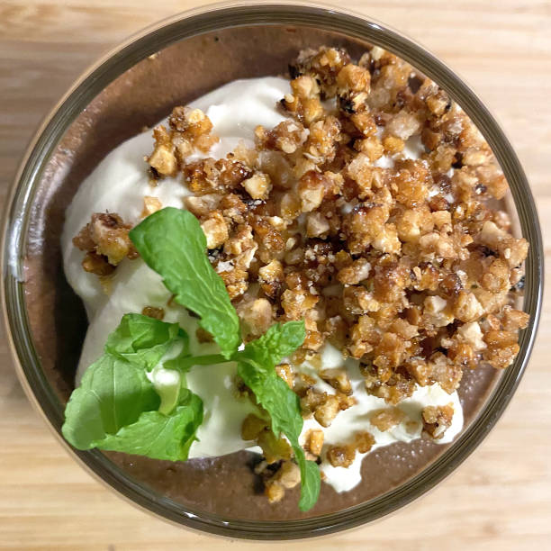 Home made chocolate mousse with crumb and mint leaf