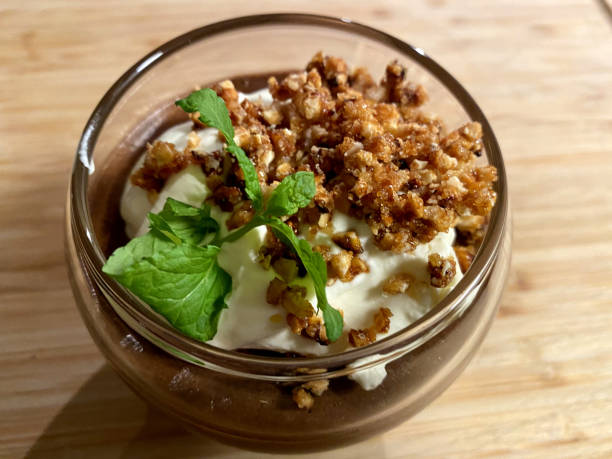 Home made chocolate mousse with crumb and mint leaf