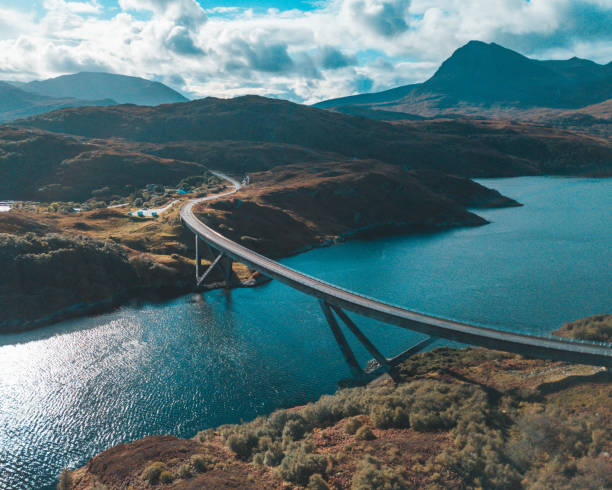 Kylesku Bridge from above An aerial shot of Kylesku Bridge on the North Coast 500 road. arch bridge photos stock pictures, royalty-free photos & images