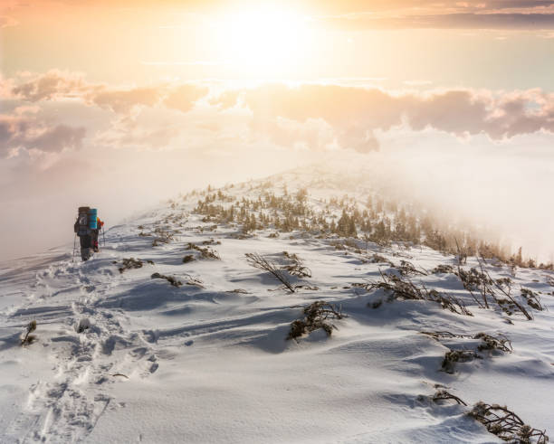istock hikers group in a winter mountains at the sunset 1289023746