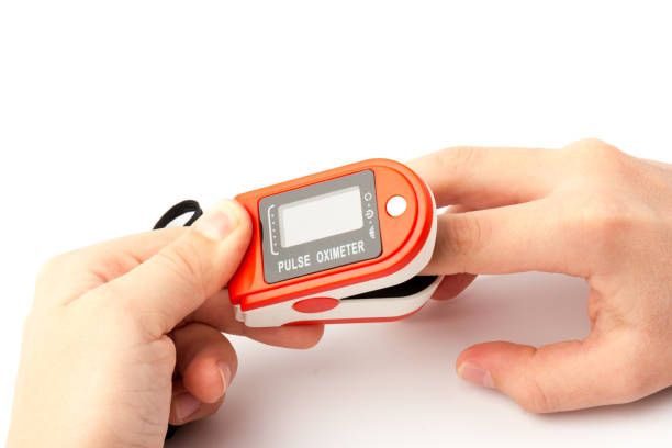 istock Pulse Oximeter, finger digital device to measure oxygen saturation in blood. Coronavirus symptoms concept. 1289025625