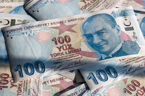 Macro shooting of a heap of 100 Turkish Lira bill. Image can be used all issues about Turkish economy and financial situations.
