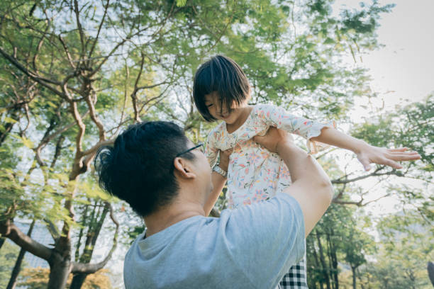 istock Father with daughter in the park 1289027307