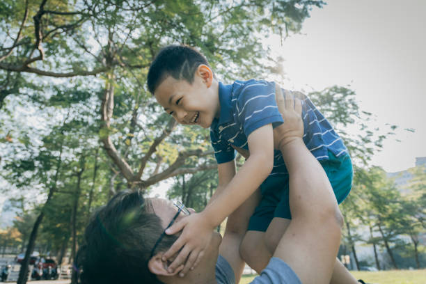 istock Father and son in the park 1289027349