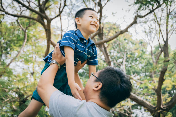 istock Father and son in the park 1289027405