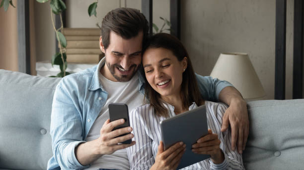istock Banner view of happy couple using gadgets 1289027503
