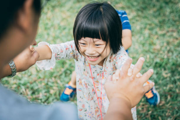 istock Father with daughter in the park 1289027523