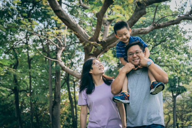 istock Parents play with kid outdoor 1289027540
