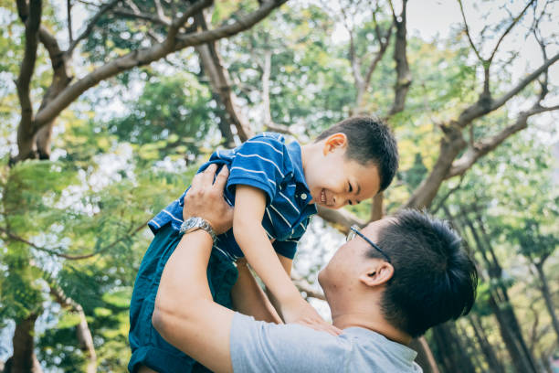 istock Father and son in the park 1289027550