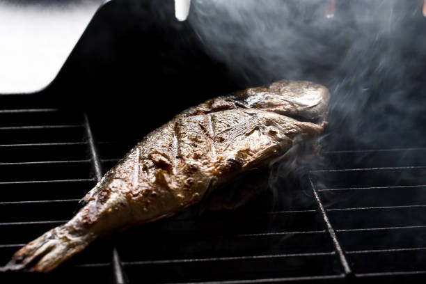 dorado fish cooking on the grill