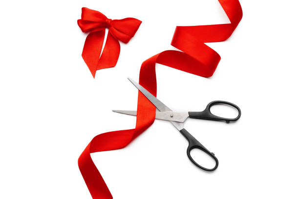 istock ribbon with scissors isolated on white. creative photo. 1289029854