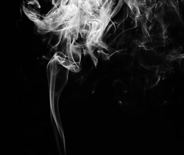 istock abstract fragment movement of white smoke on black background. 1289030601