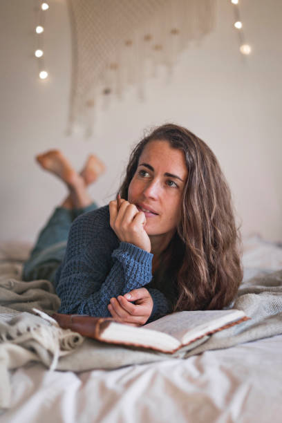 istock Woman thinking about what to write in her diary 1289032026