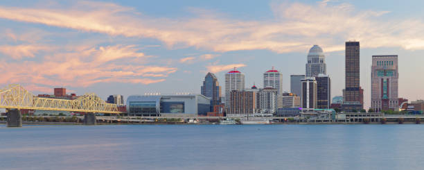 Louisville Skyline Panorama - Kentucky Panoramic view of the skyline of Louisville - the largest city in the commonwealth of Kentucky - as seen at dusk from across the Ohio river. ohio river photos stock pictures, royalty-free photos & images