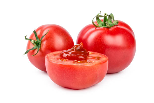 istock tomato sauce, ketchup on a sliced tomato isolated on white background 1289033185