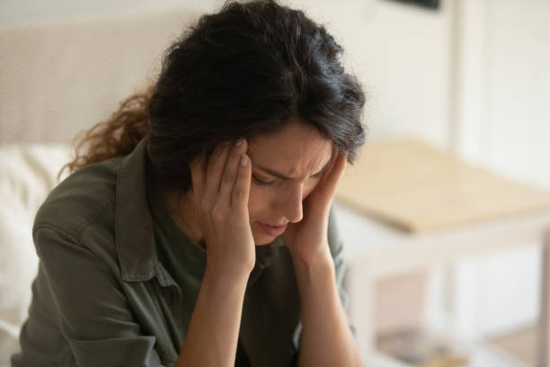 istock Anxious young woman distressed with negative news 1289033467