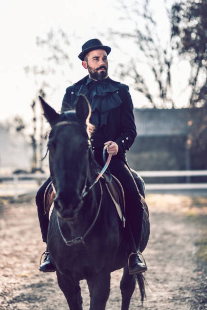 istock Elegant Rancher Male And His Black Mare 1289033623