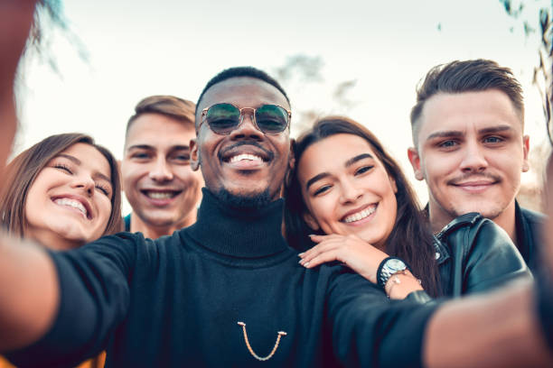 istock Selfie By Smiling Multiethnic Friends 1289035276