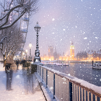 Jubilee Gardens and Houses of Parliament during a snowstorm in London.