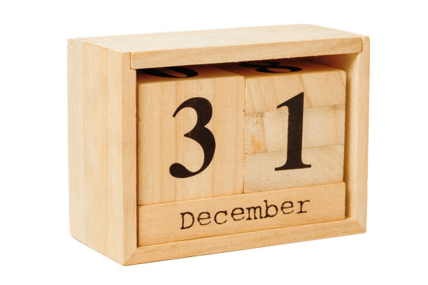 istock wood calendar isolated on white background. close up 1289038823