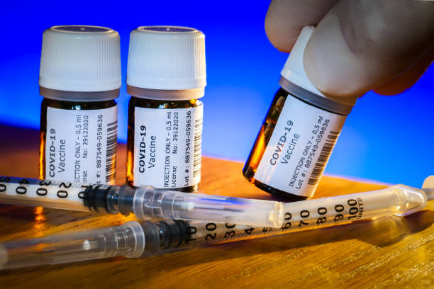 istock A creative image of some Covid-19 vaccine bottles ready to be injected 1289038871