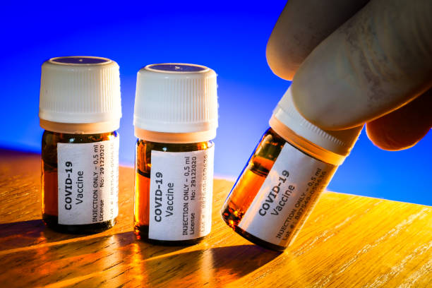 istock A creative image of some Covid-19 vaccine bottles ready to be injected 1289038888