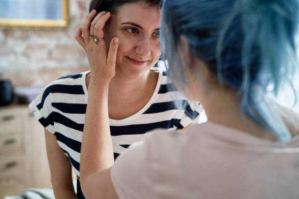 istock Lesbian couple in love tenderly looking at each other 1289040464