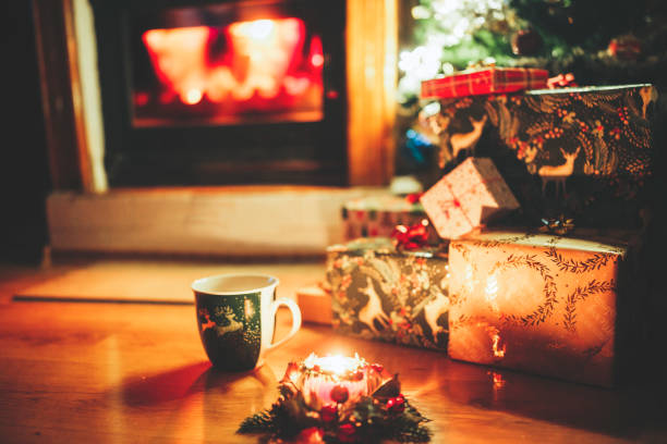 istock Beautifully decorated  home for Christmas with candle, pine tree and presents 1289043909