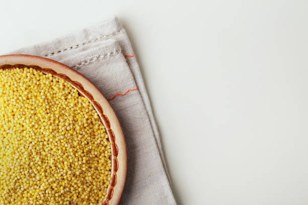 istock Millet or foxtail grain on plate, close up, top view 1289045358