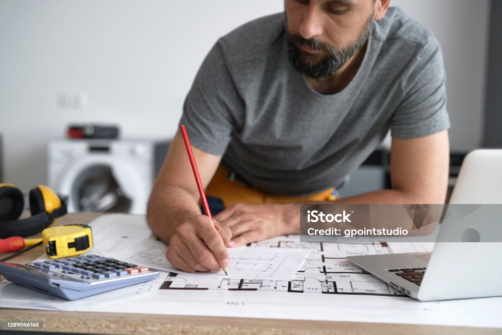 Carpenter Writing Carpenter Writing Down Measurements On His Projects Stock Photo ...