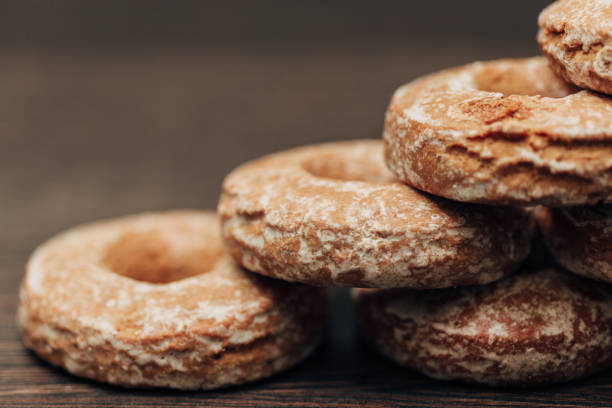 istock Beautiful Bagels and Gingerbreads Lie on a Brown Background 1289048945