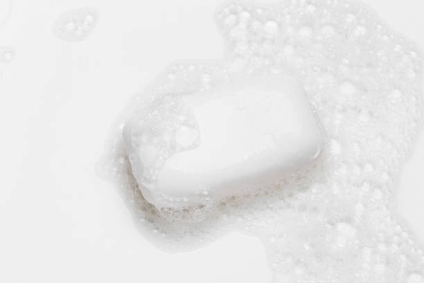 istock Soap bar and foam on white background, top view. Mockup for design 1289049066