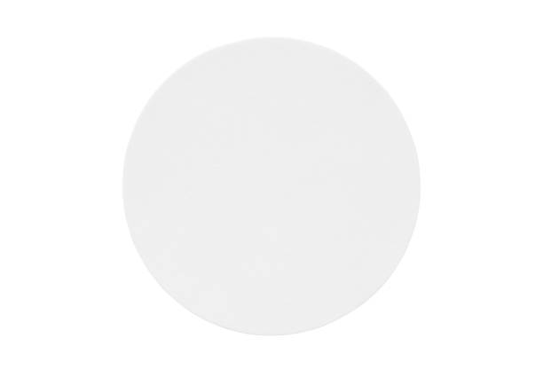 istock Blank white round paper sticker label isolated on white background 1289051126