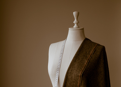 Tailor's mannequin, measuring and fabric of clothes.