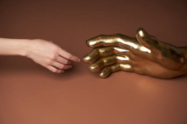 istock Human and robot handshake gesture, close-up 1289051680