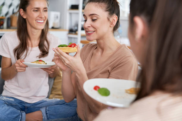 istock Three women during a homemade food feast 1289052412