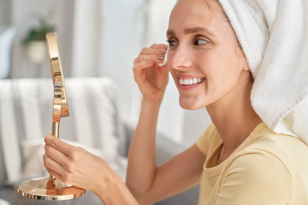 istock Woman removing make up at home 1289052546