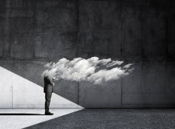 istock Man Standing Under A Cloud Of Stress 1289054227