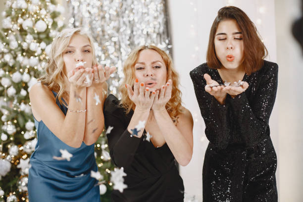 istock Three women in a christmass decorations 1289054379