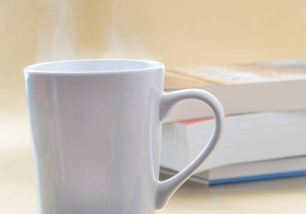 istock Coffee or tea with books effect in the background to give a warm feeling . 1289054400