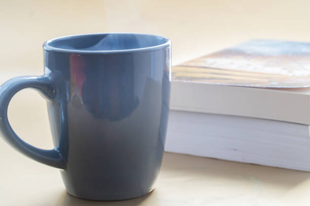 istock Coffee or tea with books effect in the background to give a warm feeling . 1289054417