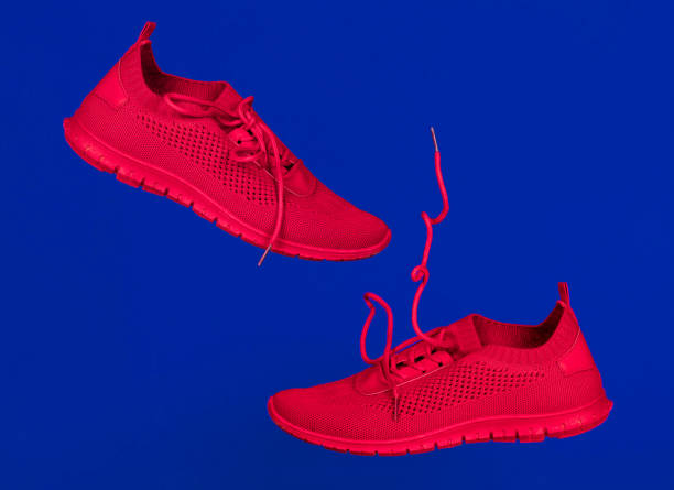 istock red running shoes levitate against a blue background 1289055319