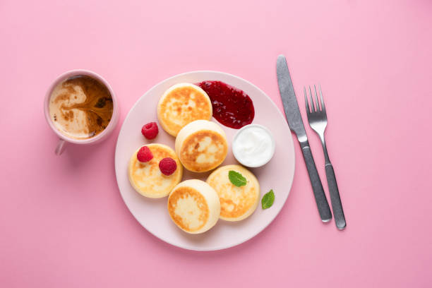 istock Fried cottage cheese fritters with raspberry sauce and sour cream 1289056257