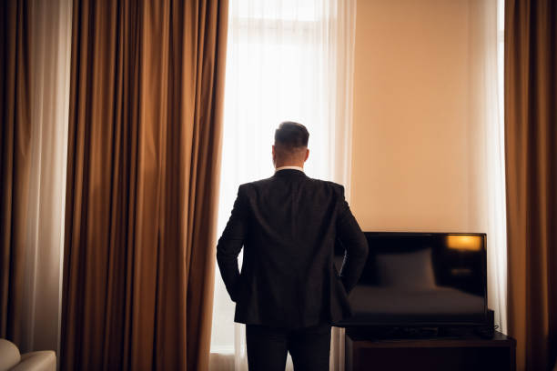 istock A businessman in a classical formal suit standing, looking at th 1289062502